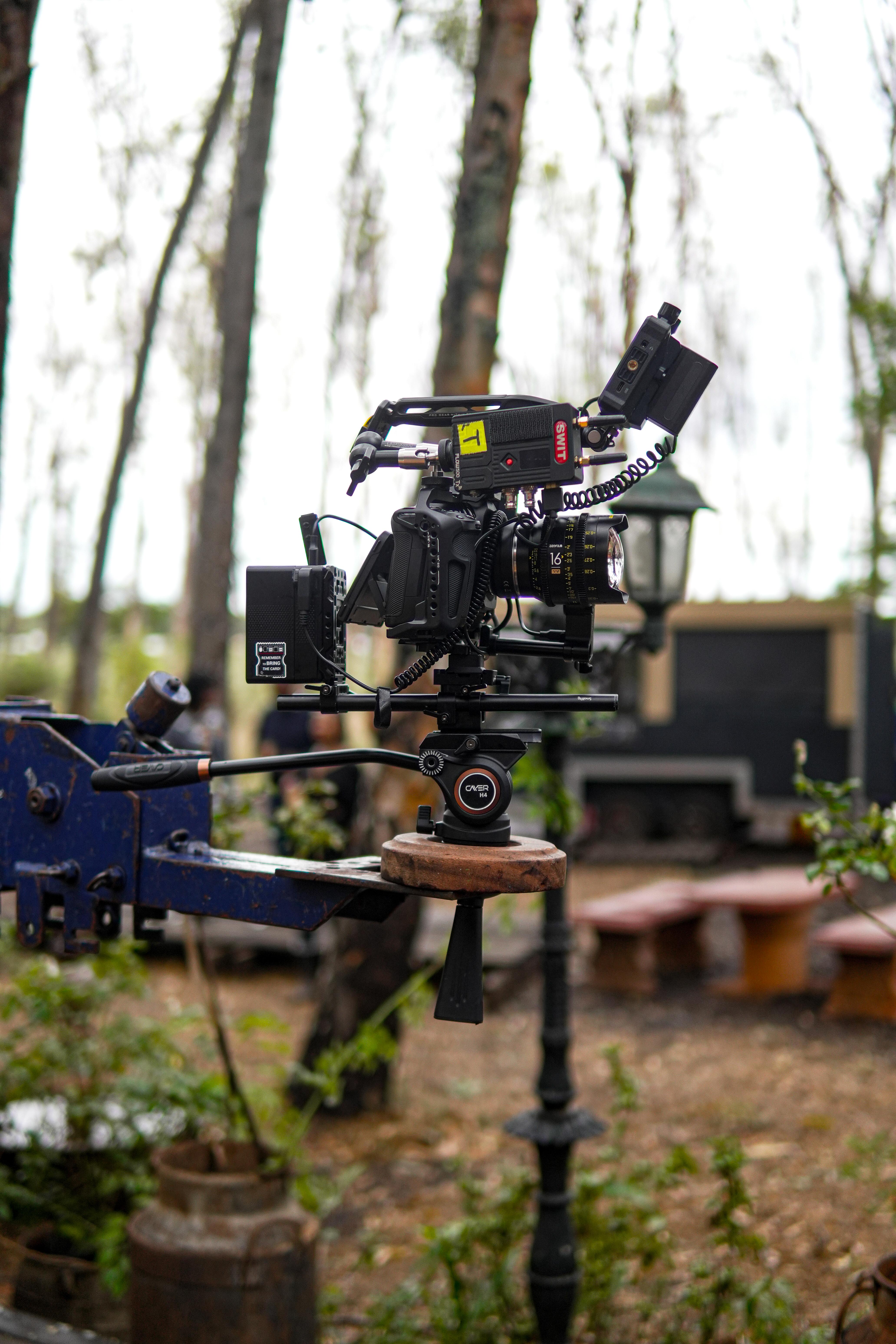 Modern high-end cinema camera on a stabilizer in a moody studio
